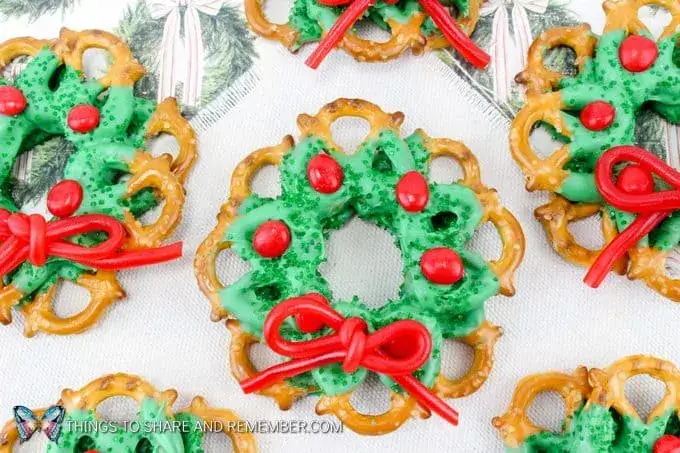 pretzels decorated with green chocolate and arranged to look like Christmas wreaths.