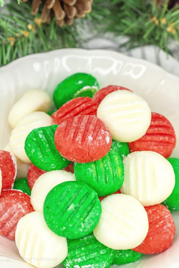 bowl of red, green, and white cream cheese mints.