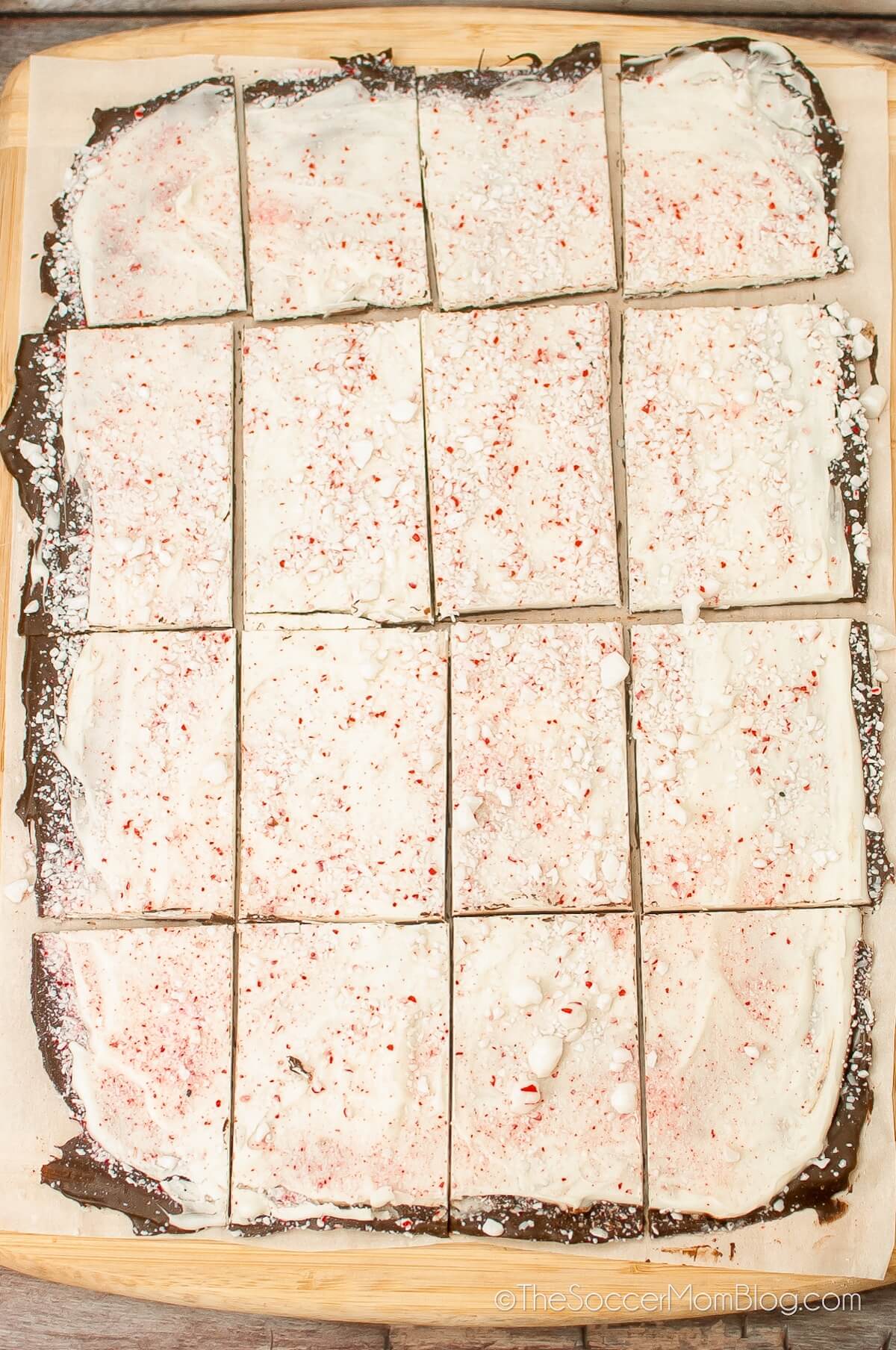 homemade peppermint bark on baking sheet, cut into squares.