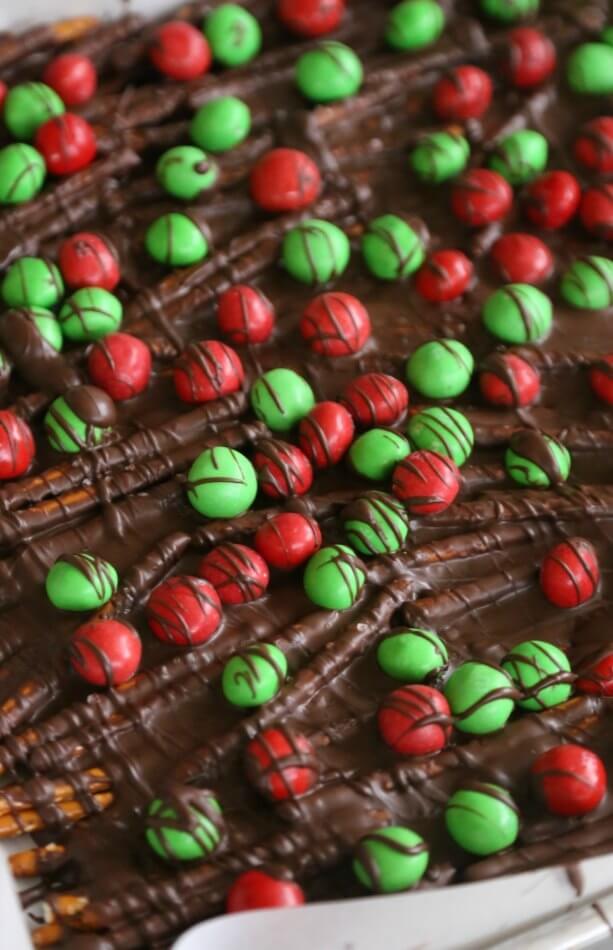 chocolate pretzel bark topped with Christmas M&Ms.