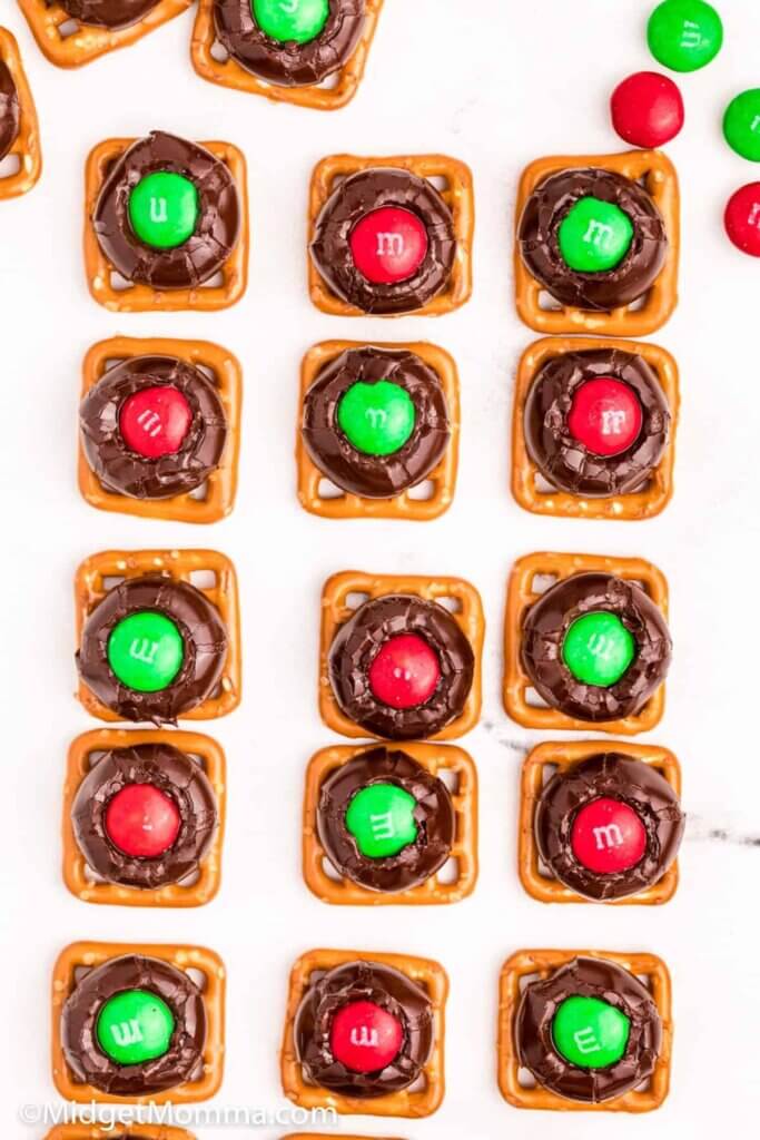 pretzel squares topped with chocolate and Christmas M&Ms.