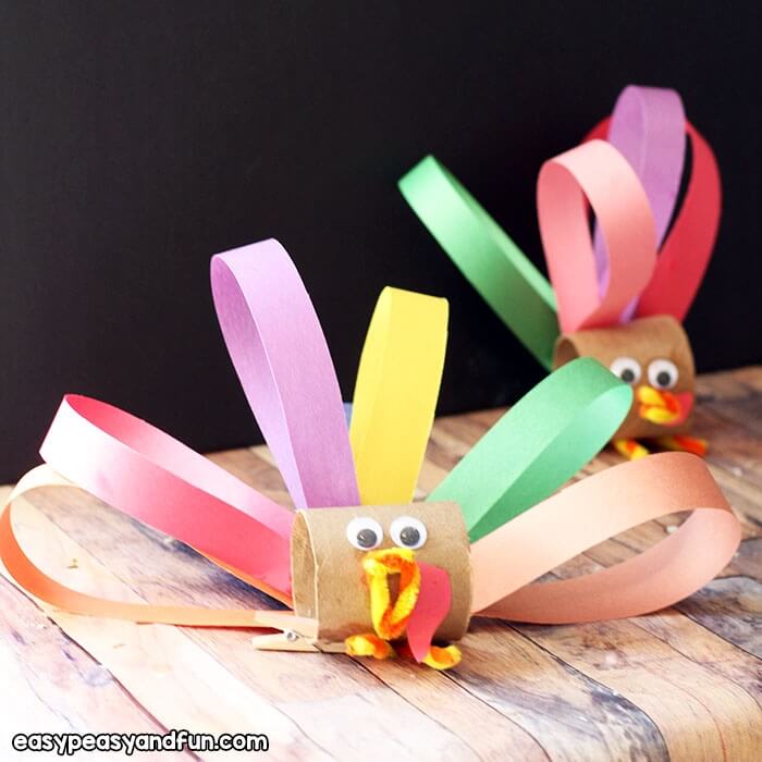 turkey craft made with toilet paper rolls and constructions paper.