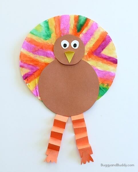 turkey paper craft made with folded paper accordion legs.