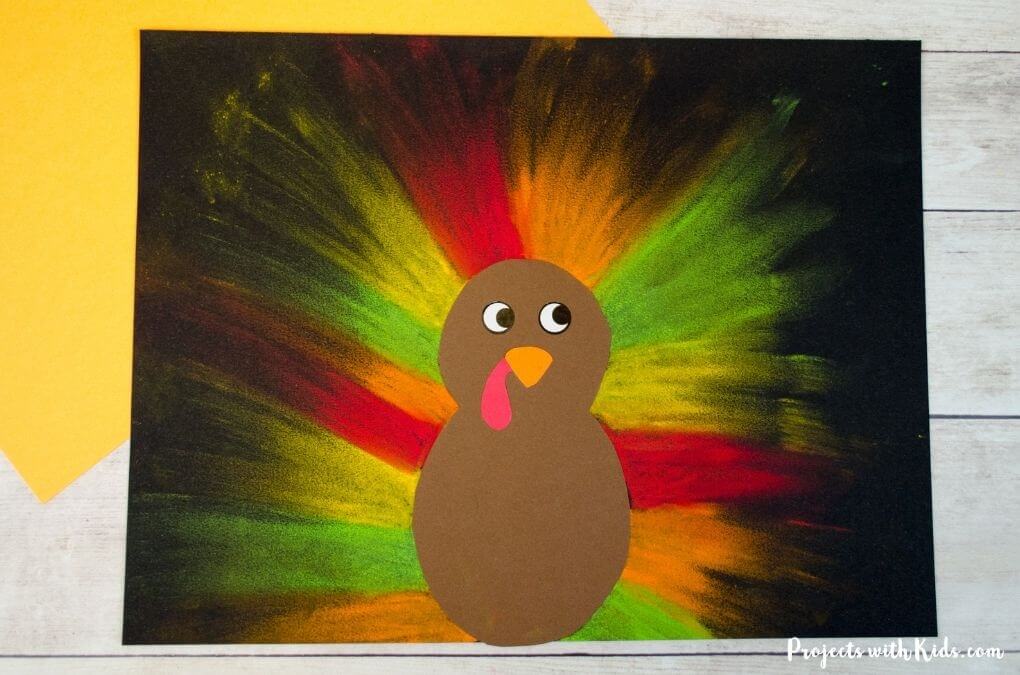 turkey art made with oil pastels on black paper.