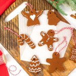 wooden board with an array of homemade cinnamon Christmas ornaments.
