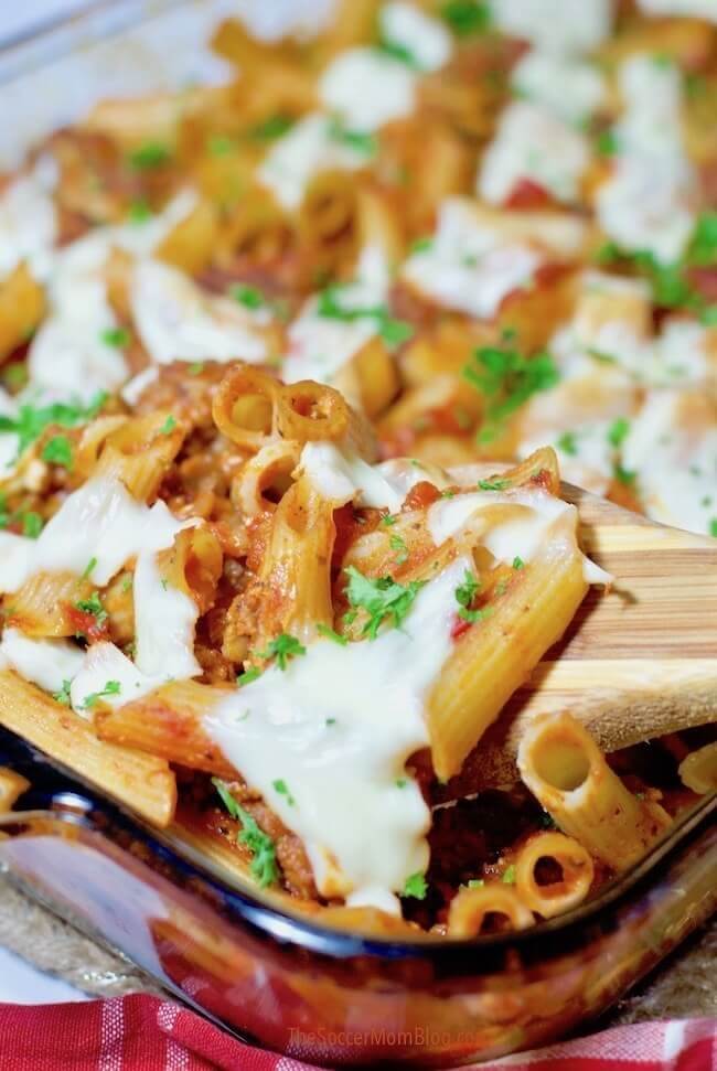 baked ziti with cheese on top.