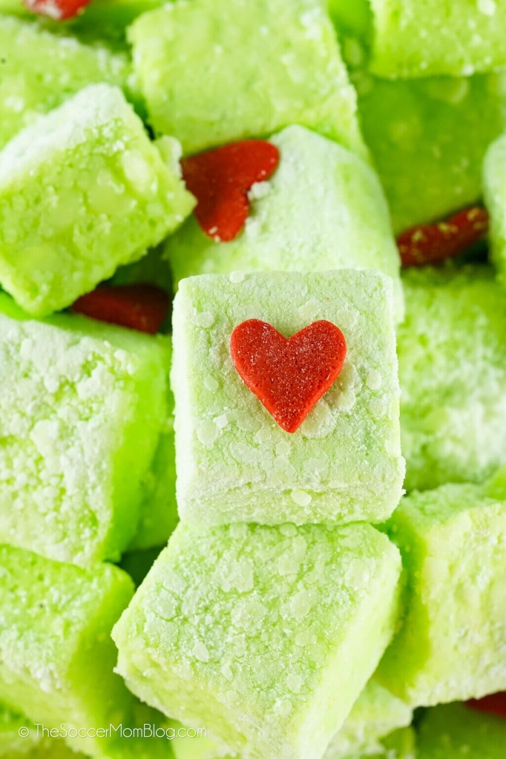 homemade Grinch marshmallows with red heart sprinkle.