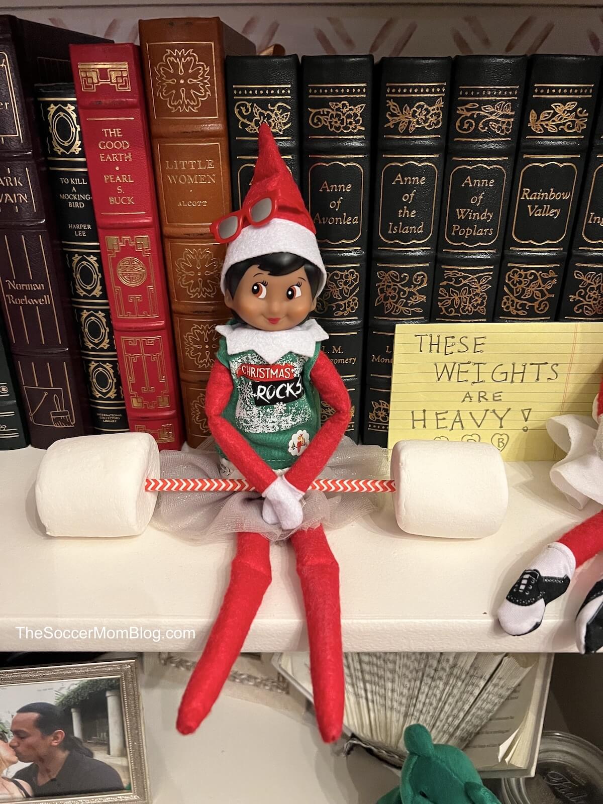 elf on shelf with marshmallow barbell.