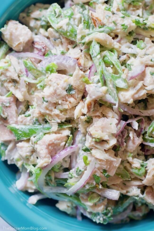 close up of chicken salad made with onions, asparagus, and dill.