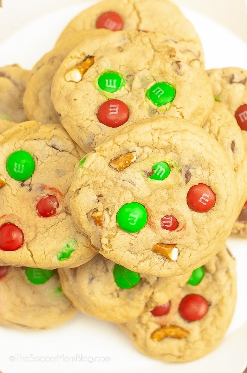 close up of a plate of Christmas cookies with red and green M&Ms.