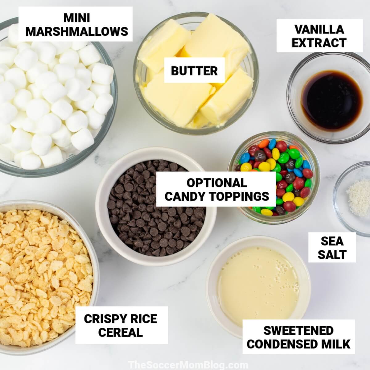 ingredients to make brown butter rice krispie treats, with text labels: mini marshmallows, butter, vanilla, crispy rice cereal, sweetened condensed milk, sea salt.