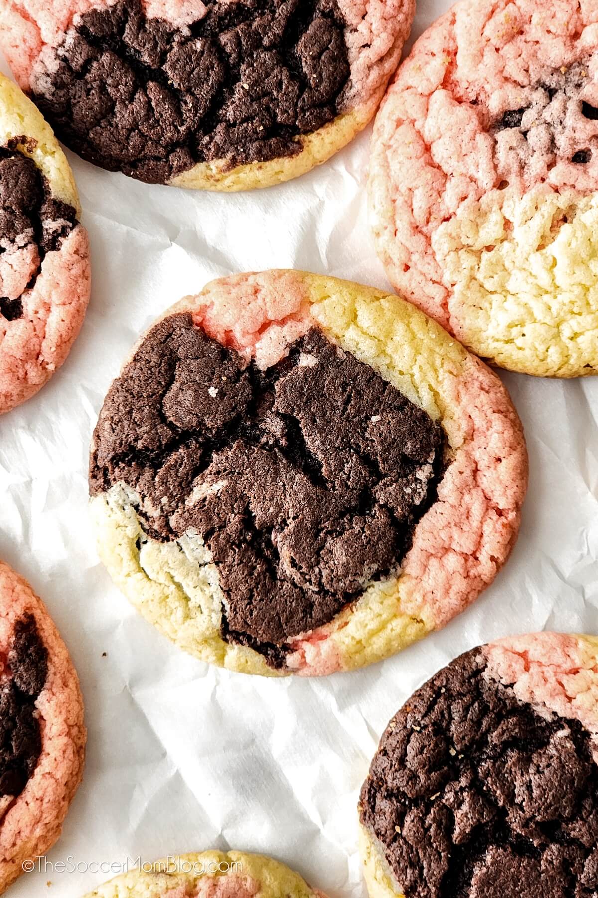 top down view of tricolor chocolate, strawberry, and vanilla cookies.