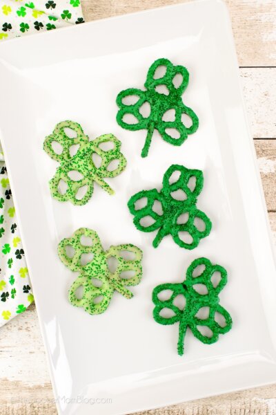 pretzel twists dipped in green chocolate and arranged to look like shamrocks.