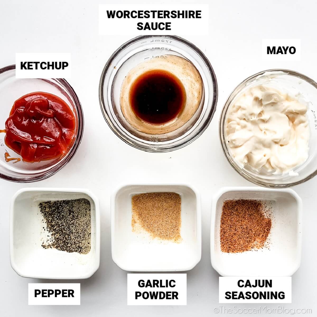 Copycat Raising Cane's Sauce ingredients: ketchup, Worcestershire, mayo, pepper, garlic powder, and cajun seasoning.