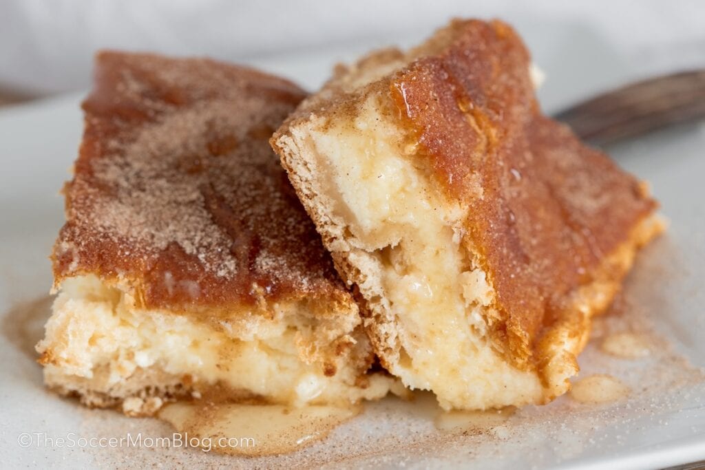 churro cheesecake bars topped with honey.