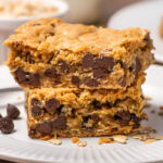 A pile of Chocolate Chip Oatmeal Bars on a plate.