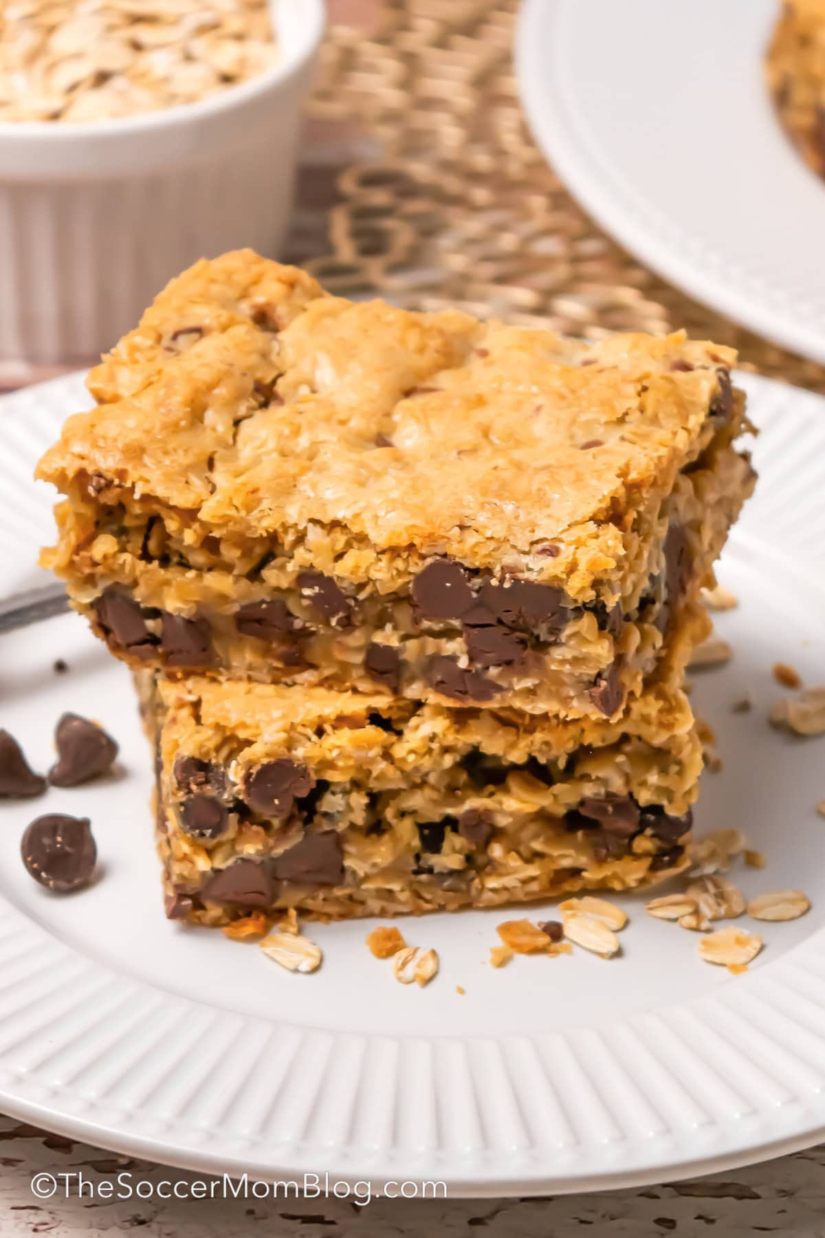 A pile of Chocolate Chip Oatmeal Bars on a plate, close up.