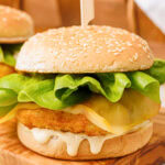 A Copycat Filet-O-Fish sandwich on a wooden tray.
