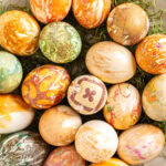 a bowl of rustic patterned silk-dyed Easter eggs.