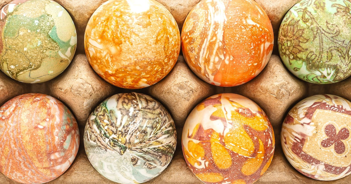 close-up of a carton of silk-dyed Easter eggs.