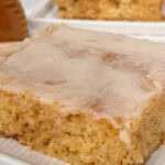 close up of a slice of glazed honey bun cake.