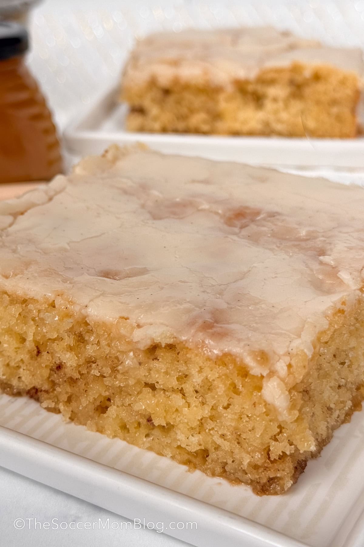 close up of a slice of glazed honey bun cake.