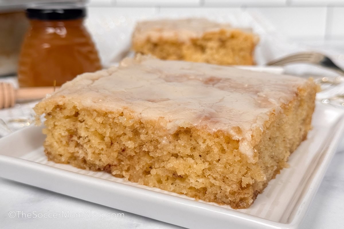 yellow honey bun sheet cake topped with glaze.