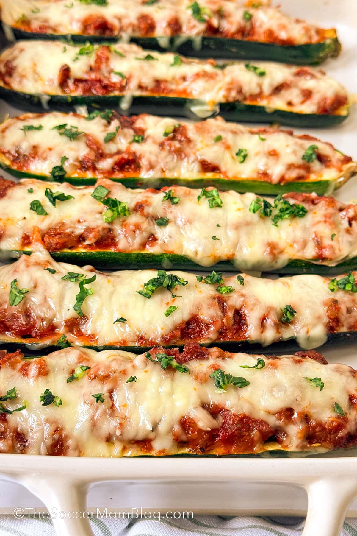 stuffed zucchini in a baking dish.