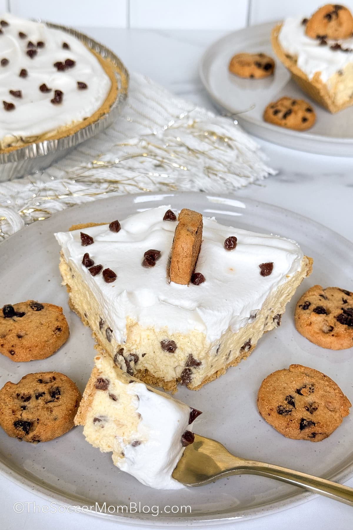 chocolate chip pudding pie, slice on plate with bite taken.
