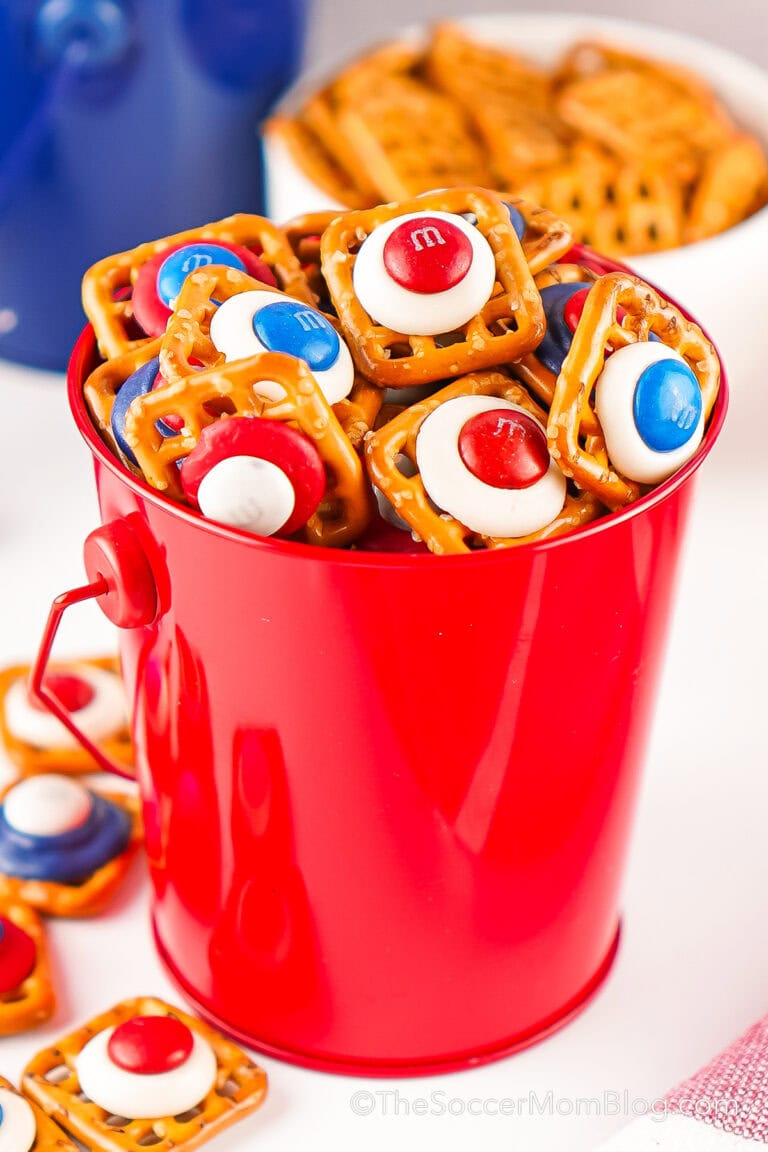 a red bucket of pretzel bites decorated in red, white, and blue candy.
