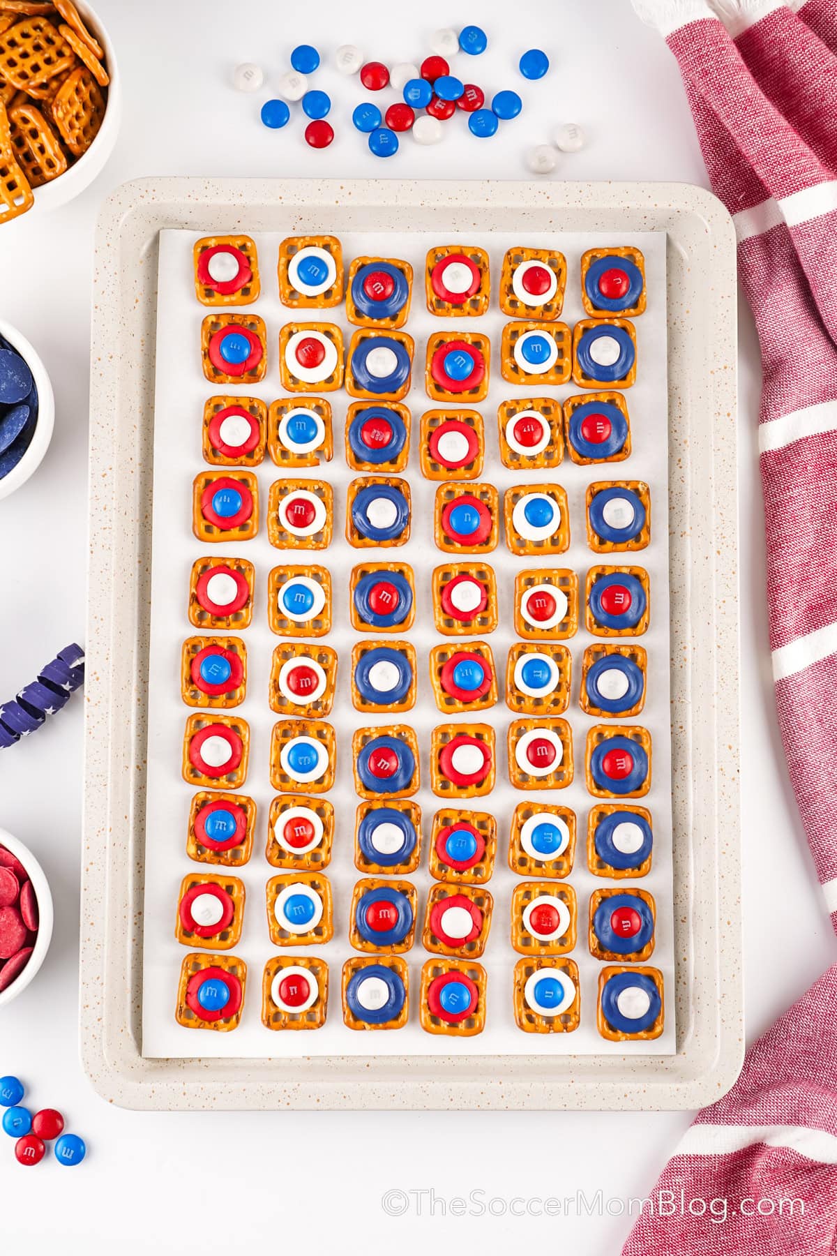 baking sheet lined with homemade 4th of July pretzel treats.