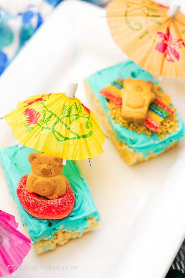 Two beach day rice krispie treats on a white plate.