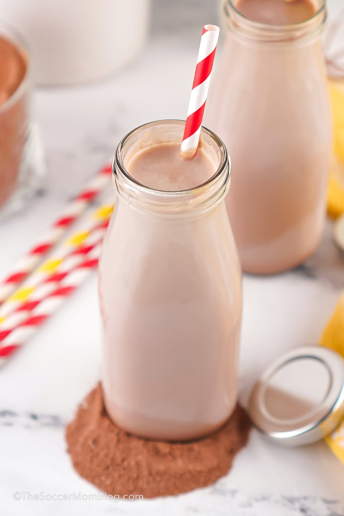 bottle of homemade chocolate milk with a straw.