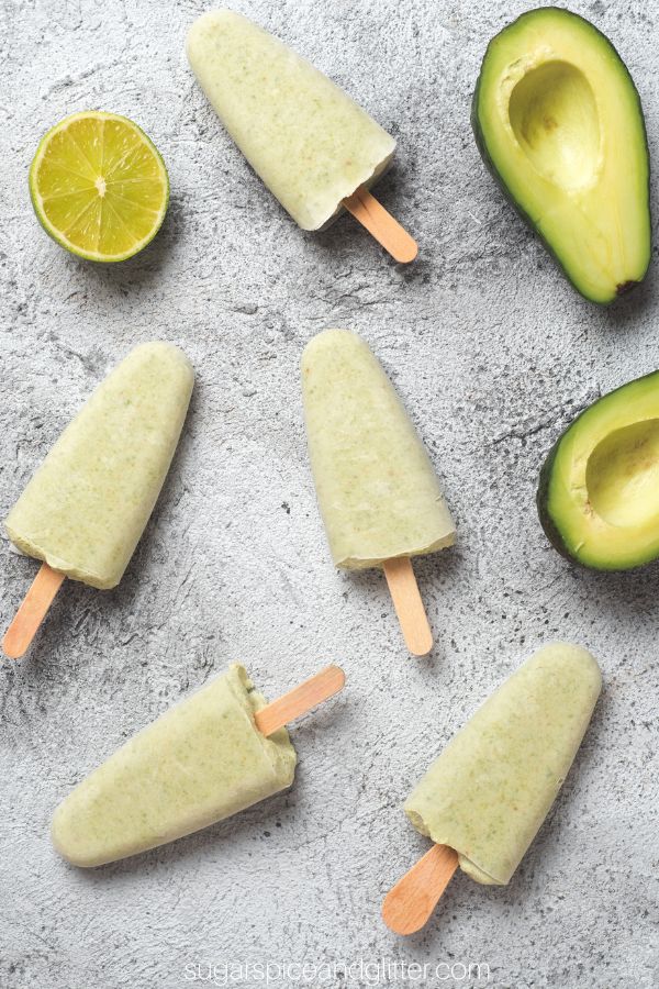 key lime pie popsicles on a countertop.