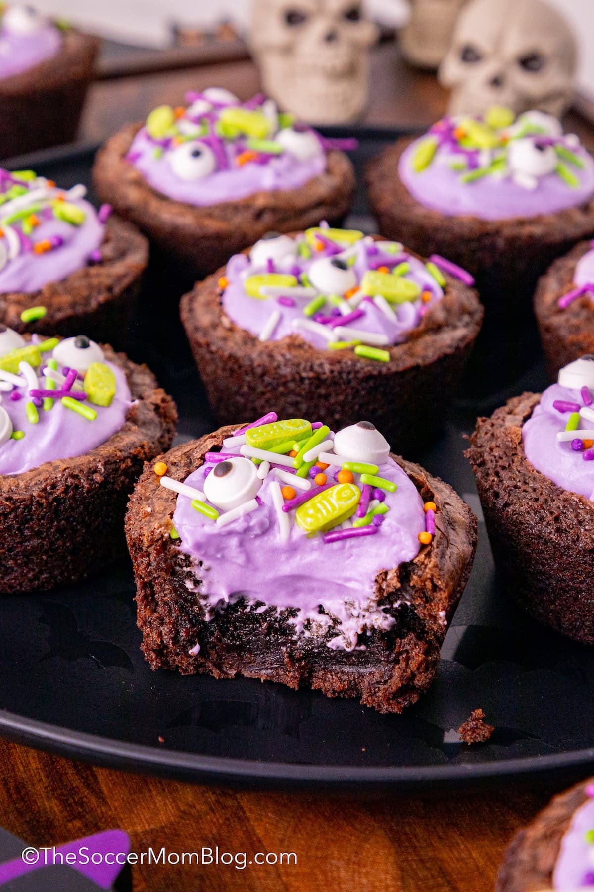 bite-size brownies filled with purple frosting and sprinkles to look like witch's cauldrons for Halloween/